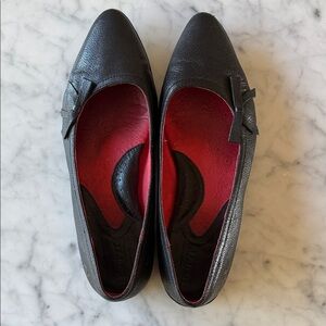 Born black leather flats with bow detail. Size 8-1/2